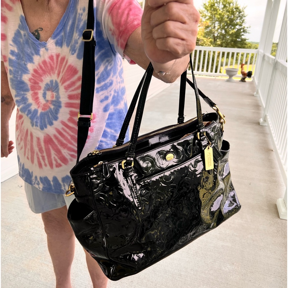 Authentic coach diaper bag with gold accents  included changing pad.